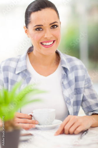 Photo: woman drinking coffee at home woman drinking coffee at home