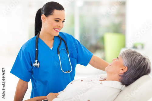 Photo: medical nurse talking to senior patient medical nurse talking to senior patient