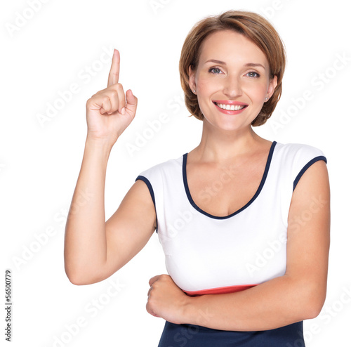 Photo: happy woman pointing up with her finger happy woman pointing up with her finger