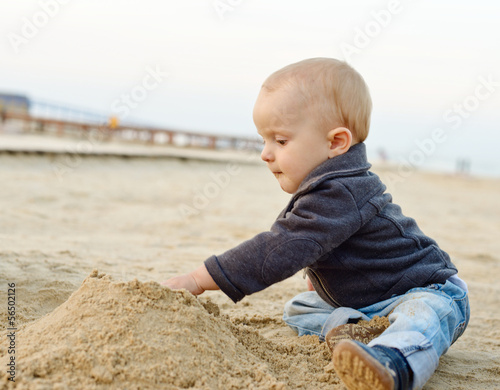 Photo: baby boy playing in sand baby boy playing in sand