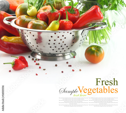 Photo: Vegetables in colander, isolated on white Vegetables in colander, isolated on white