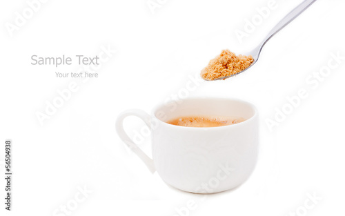 Photo: a cup of espresso coffee and spoon of brown sugar a cup of espresso coffee and spoon of brown sugar