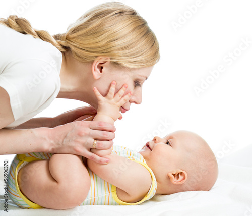Photo: happy mother having fun with her baby boy infant happy mother having fun with her baby boy infant