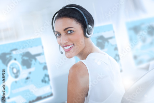 Photo: Pretty call center employee using futuristic interface hologram Pretty call center employee using futuristic interface hologram