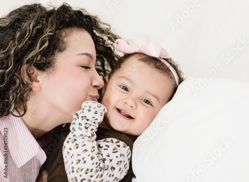 Photo: Loving mother kissing her baby Loving mother kissing her baby