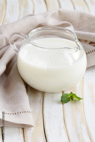 Photo: glass jug with milk, rustic style glass jug with milk, rustic style