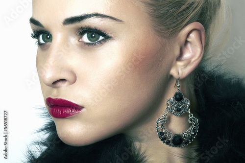 Photo: beautiful blond woman in fur.Jewelry and Beauty.red lips beautiful blond woman in fur.Jewelry and Beauty.red lips