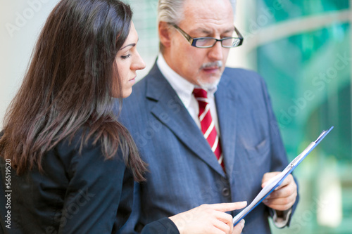 Photo: Businesspeople talking outdoor Businesspeople talking outdoor