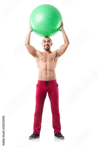 Photo: Man with swiss ball doing exercises on white Man with swiss ball doing exercises on white