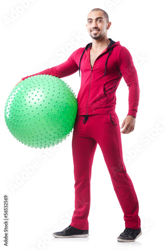 Photo: Man with swiss ball doing exercises on white Man with swiss ball doing exercises on white