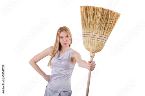 Photo: Young woman with broom on white Young woman with broom on white