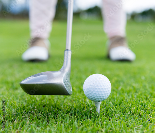 Photo: Golf player at the tee Golf player at the tee