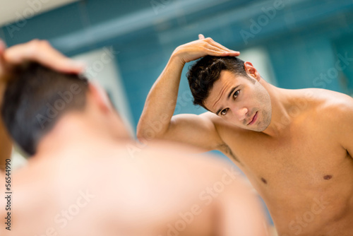 Photo: Man fixing his hair Man fixing his hair