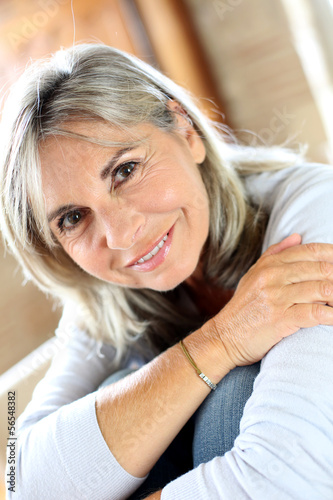 Photo: Portrait of senior woman relaxing at home Portrait of senior woman relaxing at home