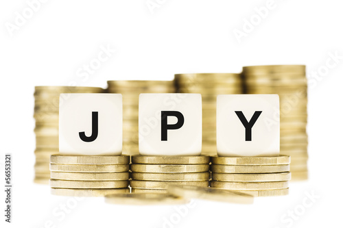 Photo: JPY (Japanese Currency) over Gold Coin Stack Isolated on White JPY (Japanese Currency) over Gold Coin Stack Isolated on White