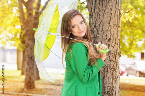 Photo: Pretty girl with transparent umbrella Pretty girl with transparent umbrella