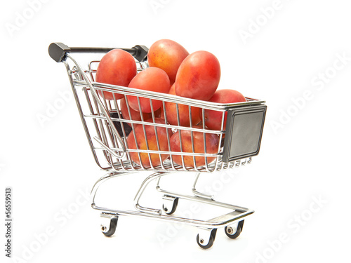 Photo: Shopping cart filled with red plums Shopping cart filled with red plums