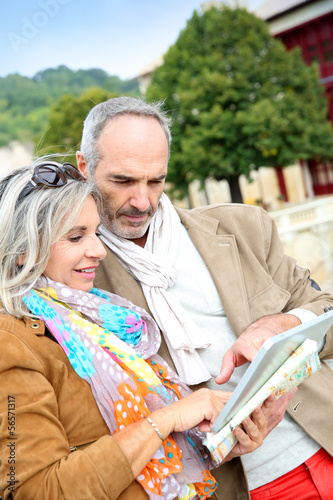 Photo: Senior couple of tourists on a trip Senior couple of tourists on a trip