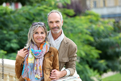 Photo: Senior couple standing on bridge Senior couple standing on bridge