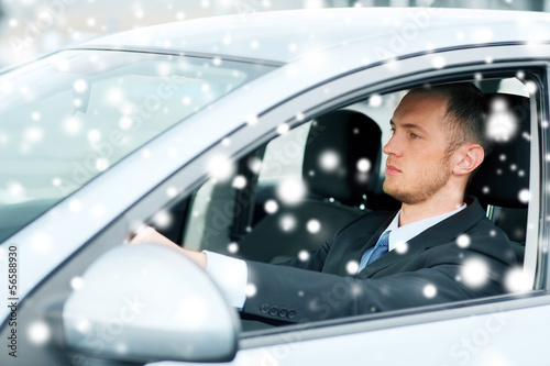 Photo: businessman driving a car businessman driving a car