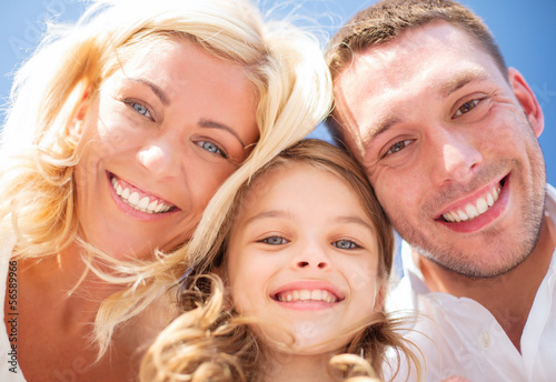 Photo: happy family with blue sky happy family with blue sky