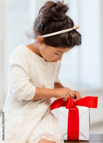 Photo: happy child girl with gift box happy child girl with gift box