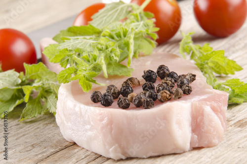 Photo: pork chop on a wooden table pork chop on a wooden table