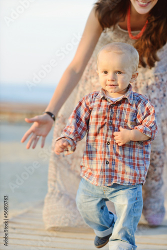 Photo: baby boy running from mother baby boy running from mother