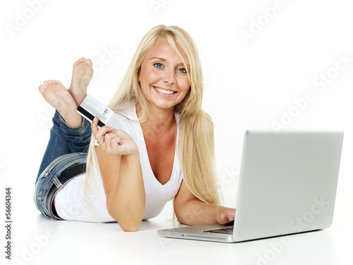 Photo: Woman with credit card did a bargain on the internet Woman with credit card did a bargain on the internet