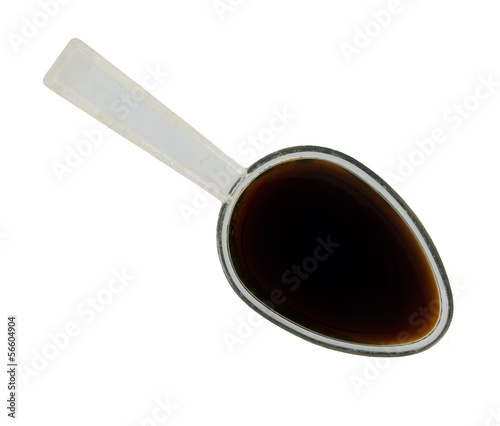 Photo: Spoonful of medicine - isolated Spoonful of medicine - isolated