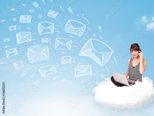 Photo: Young woman sitting in cloud with laptop Young woman sitting in cloud with laptop