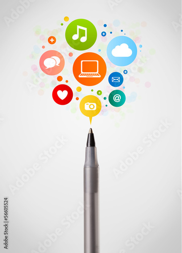 Photo: Pen close-up with social network icons Pen close-up with social network icons