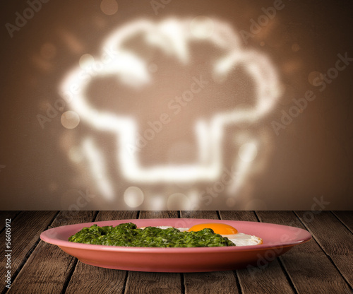 Photo: Delicious food plate with chef cook hat Delicious food plate with chef cook hat