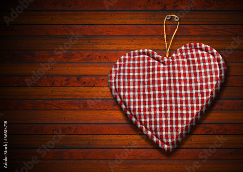 Illustration: Cloth Heart on Brown Wood Background Cloth Heart on Brown Wood Background