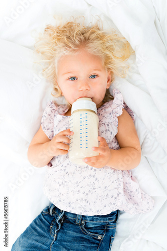 Photo: Baby girl drinking from a bottle Baby girl drinking from a bottle