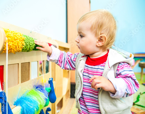 Photo: little girl in the classroom early development little girl in the classroom early development