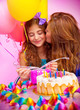 Mother kiss daughter on birthday party Mother kiss daughter on birthday party