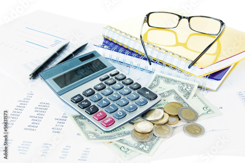 Photo: Office supplies with money and documents close up Office supplies with money and documents close up
