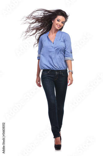 Photo: casual woman walking to you casual woman walking to you