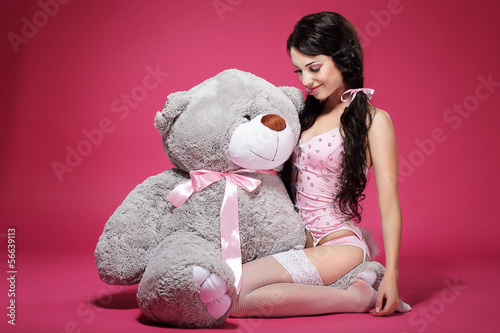 Photo: Birthday. Woman with Teddy Bear Sitting and Smiling. Dearness Birthday. Woman with Teddy Bear Sitting and Smiling. Dearness