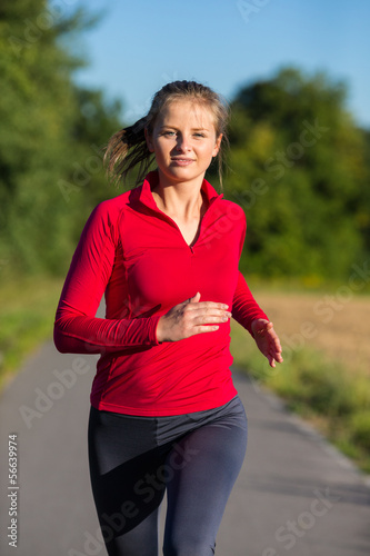 Photo: Urban leisure - woman running outdoor Urban leisure - woman running outdoor