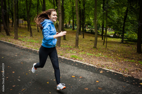 Photo: Girl running in park Girl running in park