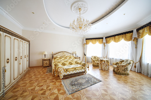 Photo: Bedroom with beautiful double bed, wardrobe and armchairs Bedroom with beautiful double bed, wardrobe and armchairs