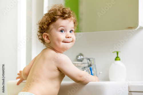 Photo: baby brushing teeth in bathroom baby brushing teeth in bathroom