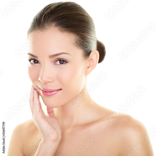 Photo: Asian beauty skincare woman touching skin on face Asian beauty skincare woman touching skin on face