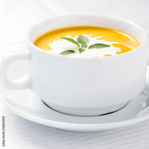 Photo: Pumpkin soup on served table Pumpkin soup on served table