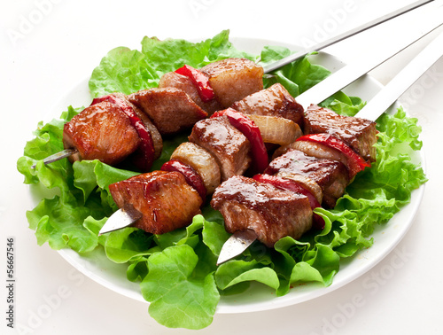 Photo: Grilled kebab (shashlik) on spits. Grilled kebab (shashlik) on spits.