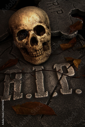 Photo: Creepy skull on gravestone Creepy skull on gravestone