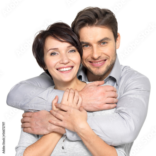 Photo: Portrait of happy couple isolated on white Portrait of happy couple isolated on white