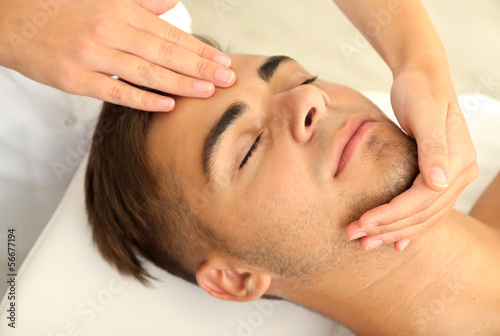 Photo: Man having head massage close up Man having head massage close up